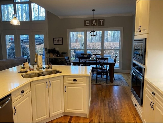 180 Hightower Lake Trl, Ball Ground, GA 30107 - kitchen featuring stainless steel appliances, dark wood-style floors, light countertops, white cabinets, and crown molding