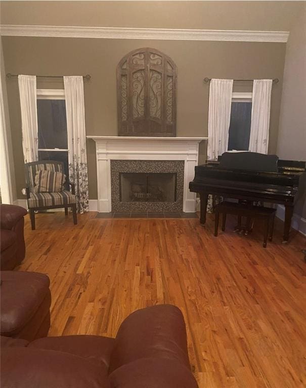180 Hightower Lake Trl, Ball Ground, GA 30107 - living room with crown molding, wood finished floors, and a tile fireplace