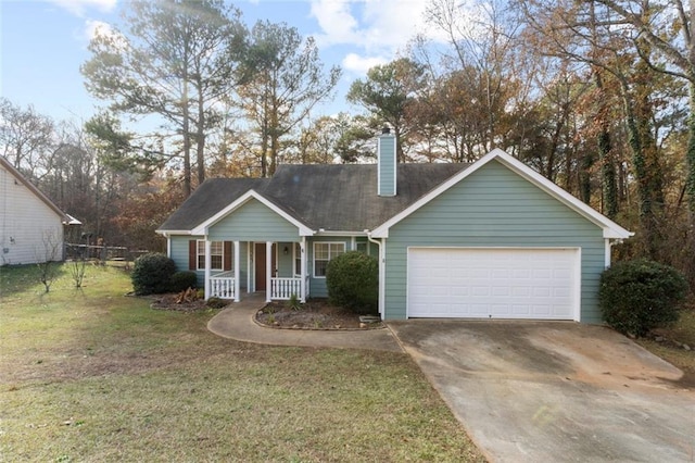 view of front of property with a front yard, a porch, and a garage