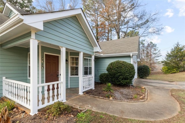 view of property exterior featuring a porch