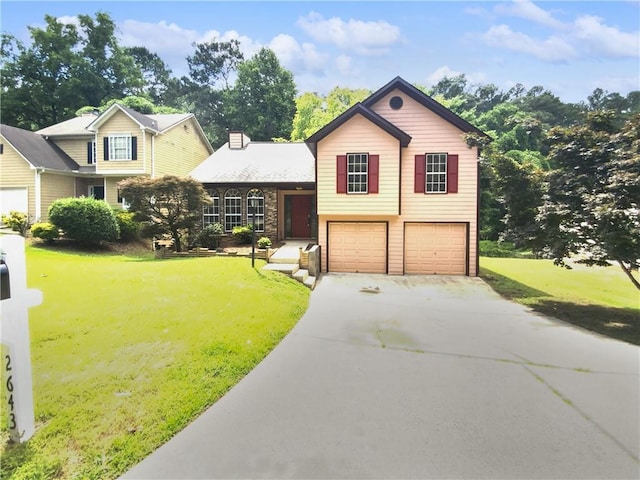 view of front of house with a front yard and a garage