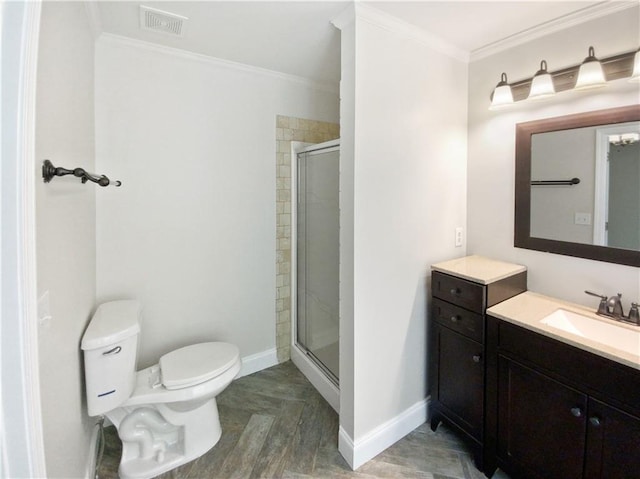 bathroom featuring vanity, toilet, ornamental molding, and walk in shower