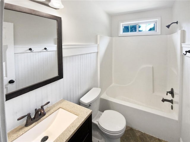 full bathroom with vanity, toilet, and shower / washtub combination