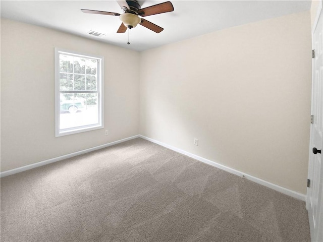 empty room with carpet flooring and ceiling fan