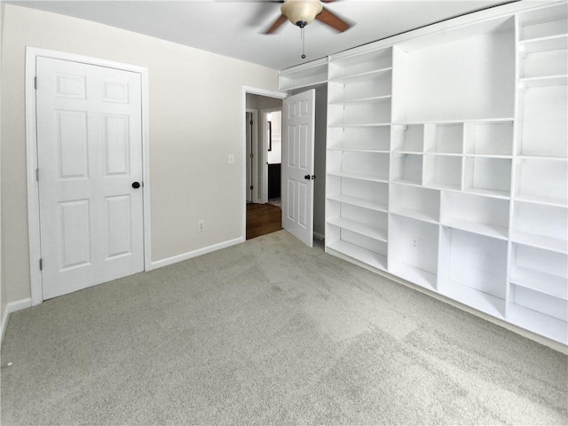 unfurnished bedroom with light colored carpet and ceiling fan