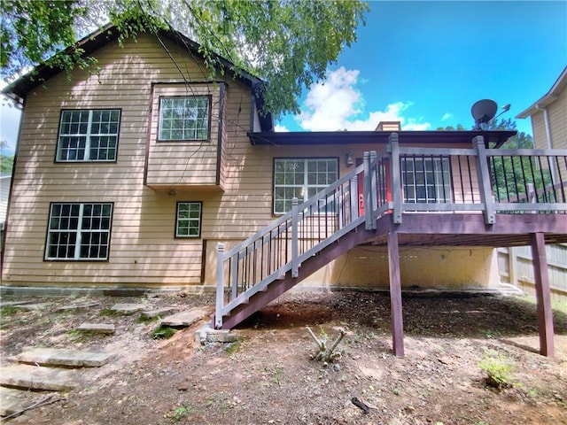 rear view of property with a deck