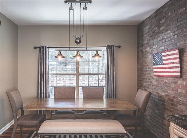 475 Brown Thrasher Ct, Alpharetta, GA 30009 - dining area featuring brick wall and wood finished floors