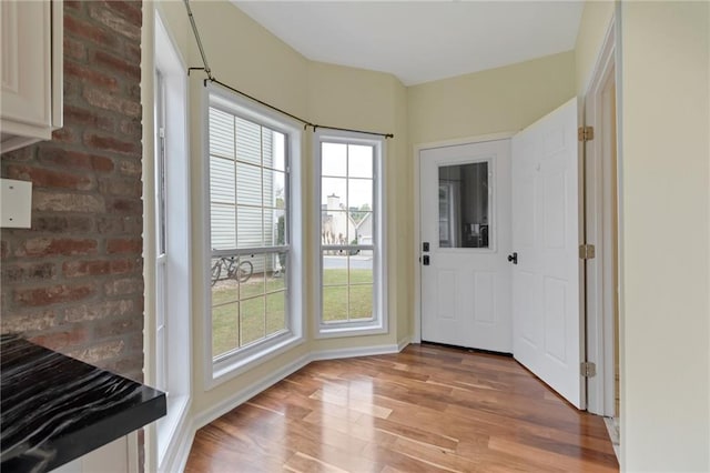 475 Brown Thrasher Ct, Alpharetta, GA 30009 - doorway to outside featuring light wood-style floors, plenty of natural light, and brick wall