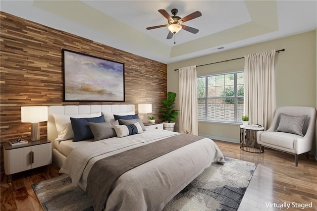 475 Brown Thrasher Ct, Alpharetta, GA 30009 - bedroom with a raised ceiling, wood finished floors, and ceiling fan