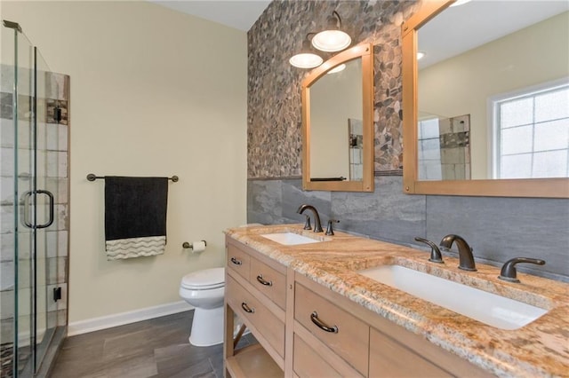 475 Brown Thrasher Ct, Alpharetta, GA 30009 - bathroom featuring a stall shower, double vanity, tasteful backsplash, and wood finished floors