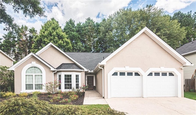 475 Brown Thrasher Ct, Alpharetta, GA 30009 - ranch-style house with stucco siding, an attached garage, concrete driveway, and a shingled roof
