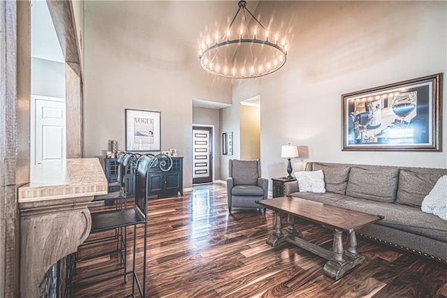 475 Brown Thrasher Ct, Alpharetta, GA 30009 - living area with dark wood-style flooring, a high ceiling, and a chandelier