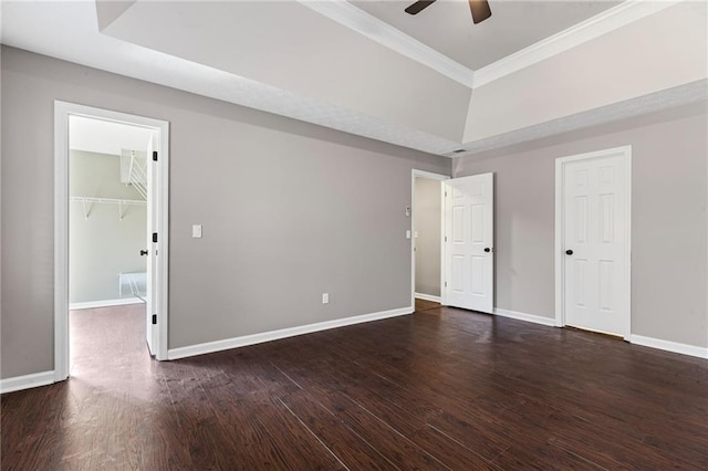 unfurnished room featuring dark wood finished floors, ceiling fan, baseboards, and ornamental molding