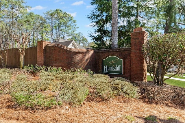 community sign with fence