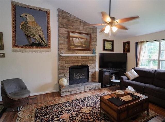236 Hiram Sudie Rd, Dallas, GA 30157 - living area featuring wood finished floors, a ceiling fan, a stone fireplace, and lofted ceiling