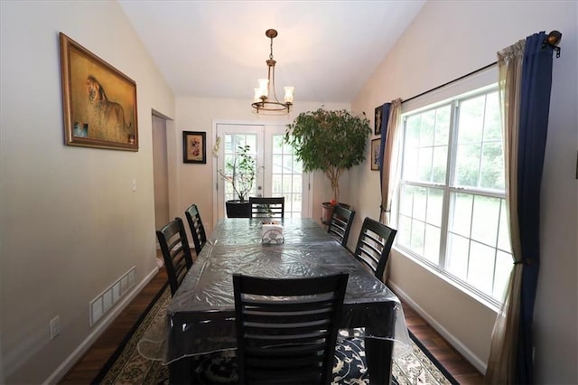 236 Hiram Sudie Rd, Dallas, GA 30157 - dining room featuring wood finished floors, vaulted ceiling, baseboards, and a chandelier