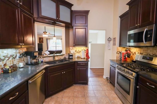 236 Hiram Sudie Rd, Dallas, GA 30157 - kitchen with appliances with stainless steel finishes, a sink, backsplash, baseboards, and light tile patterned floors