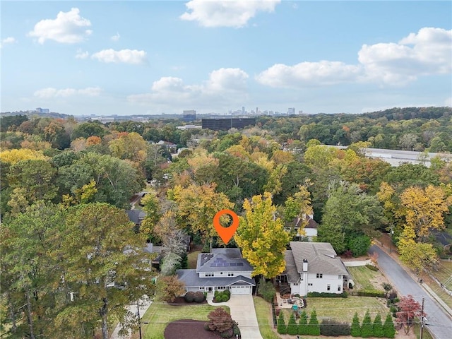 aerial view featuring a wooded view