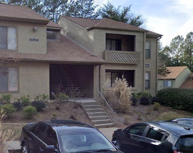 front of property featuring a balcony