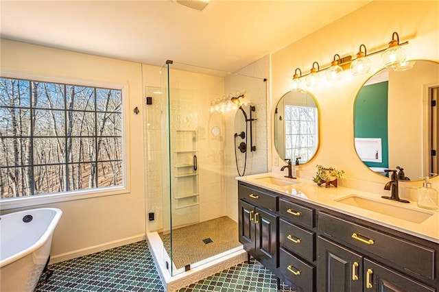 bathroom featuring vanity, separate shower and tub, tile patterned flooring, and a wealth of natural light