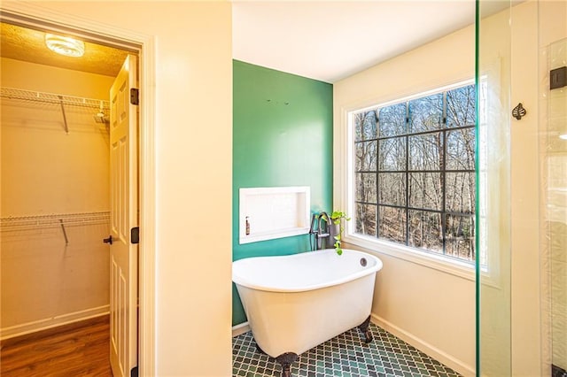 bathroom featuring a tub to relax in