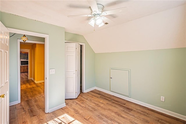 bonus room with ceiling fan, lofted ceiling, and wood-type flooring