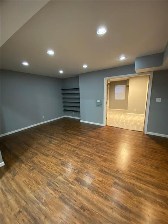 basement with dark wood-type flooring