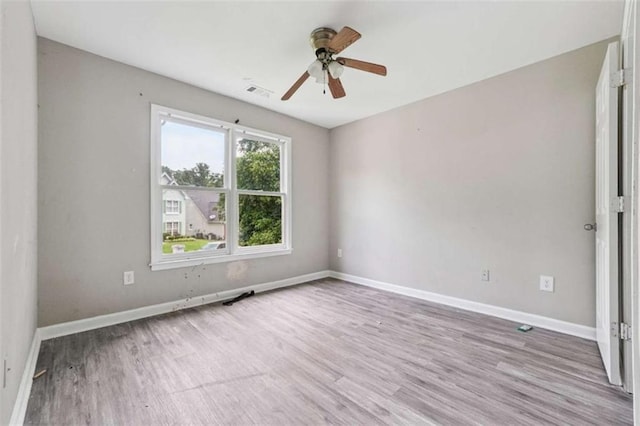4467 Boatmans Cv, Stone Mountain, GA 30083 - spare room featuring wood finished floors and a ceiling fan