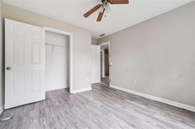4467 Boatmans Cv, Stone Mountain, GA 30083 - unfurnished bedroom with wood finished floors, a closet, and ceiling fan