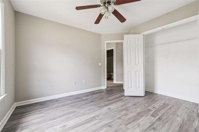 4467 Boatmans Cv, Stone Mountain, GA 30083 - unfurnished bedroom with wood finished floors, a closet, and ceiling fan
