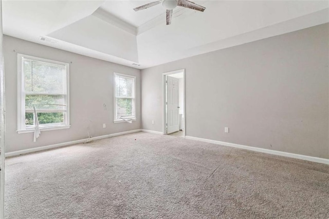 4467 Boatmans Cv, Stone Mountain, GA 30083 - unfurnished room featuring a raised ceiling, carpet floors, and ceiling fan