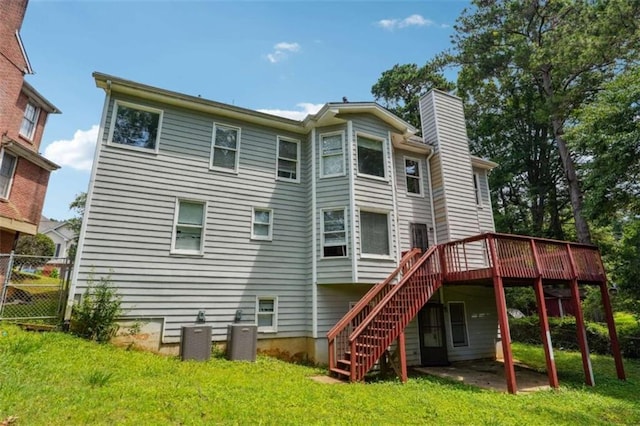 4467 Boatmans Cv, Stone Mountain, GA 30083 - rear view of house with a chimney, stairs, and a deck