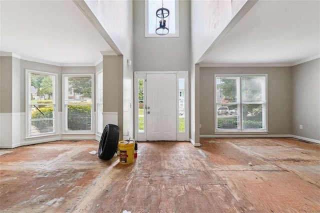 4467 Boatmans Cv, Stone Mountain, GA 30083 - entrance foyer with healthy amount of natural light, crown molding, and a towering ceiling