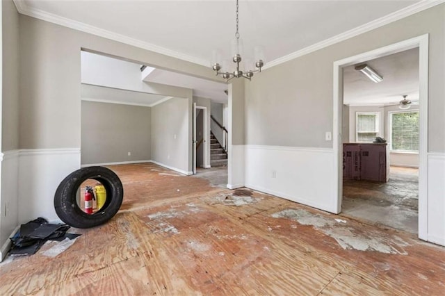 4467 Boatmans Cv, Stone Mountain, GA 30083 - unfurnished dining area featuring stairs, a chandelier, ornamental molding, and ceiling fan