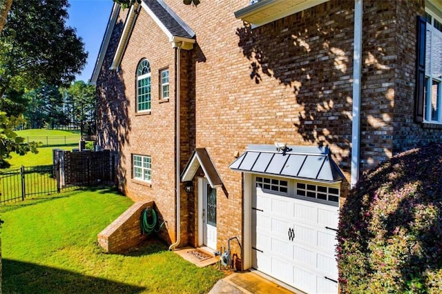 view of property exterior with a garage and a lawn