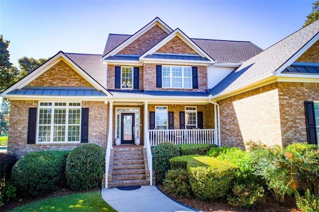 craftsman-style home featuring covered porch