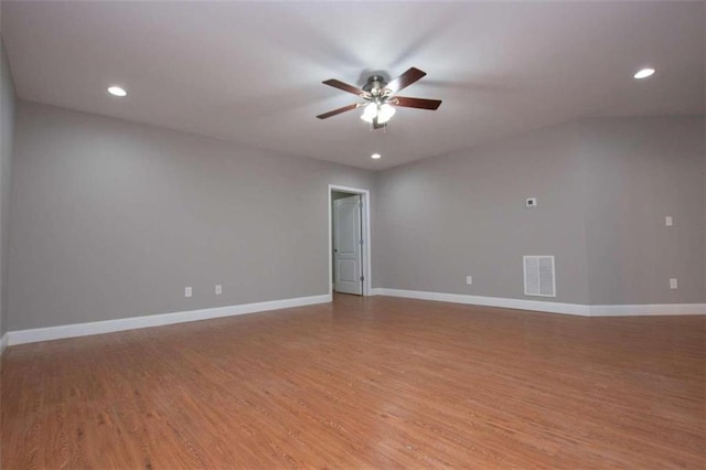 empty room featuring ceiling fan and light hardwood / wood-style floors