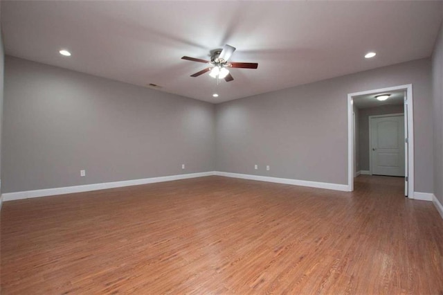 empty room with light hardwood / wood-style floors and ceiling fan