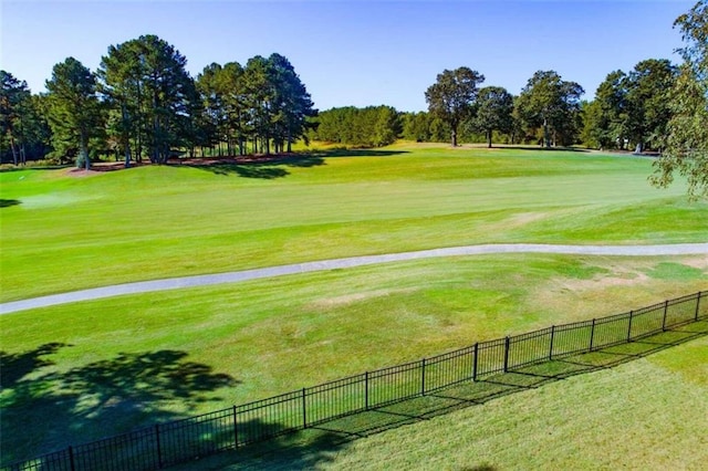 view of property's community featuring a yard