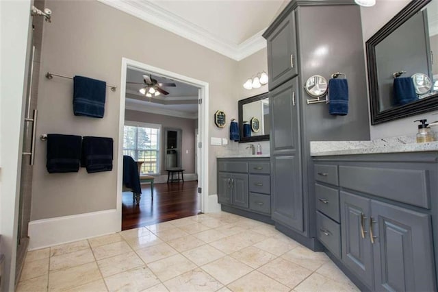 bathroom with wood-type flooring, crown molding, vanity, and ceiling fan