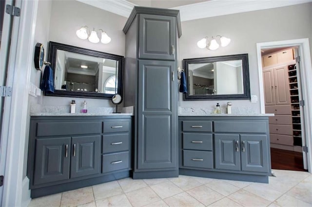 bathroom featuring vanity, tile patterned floors, and crown molding