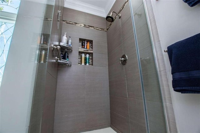 bathroom with walk in shower and crown molding