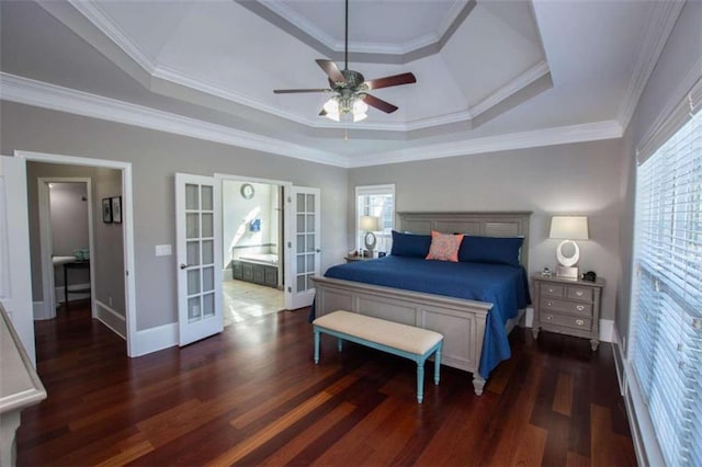 bedroom with wood-type flooring, a raised ceiling, and crown molding