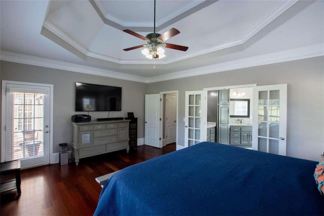 bedroom featuring french doors, dark hardwood / wood-style flooring, ceiling fan, a raised ceiling, and ornamental molding