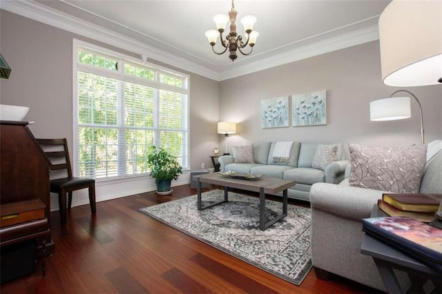 living room featuring a chandelier, dark hardwood / wood-style flooring, and ornamental molding