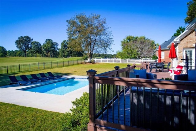 view of pool featuring a patio and a yard