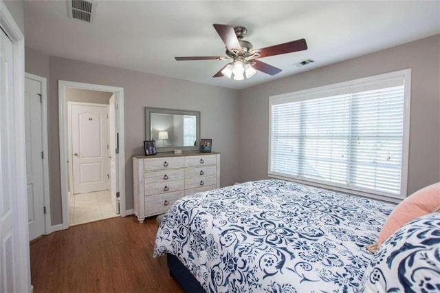 bedroom featuring ceiling fan and dark hardwood / wood-style flooring