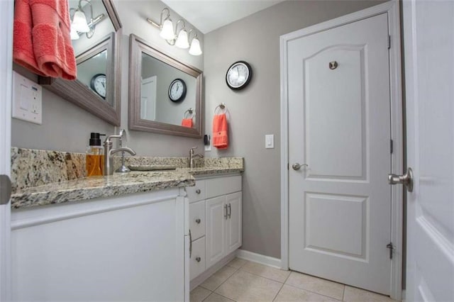 bathroom featuring tile patterned floors and vanity