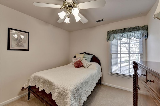 bedroom featuring a ceiling fan, baseboards, visible vents, and carpet floors