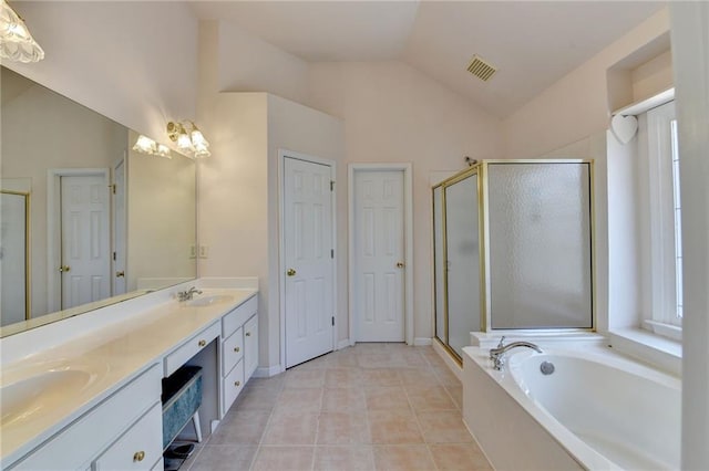 full bathroom with double vanity, visible vents, lofted ceiling, and a stall shower